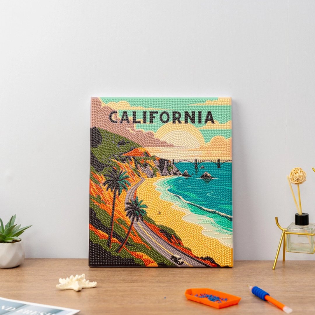 A framed travel art print with craft supplies